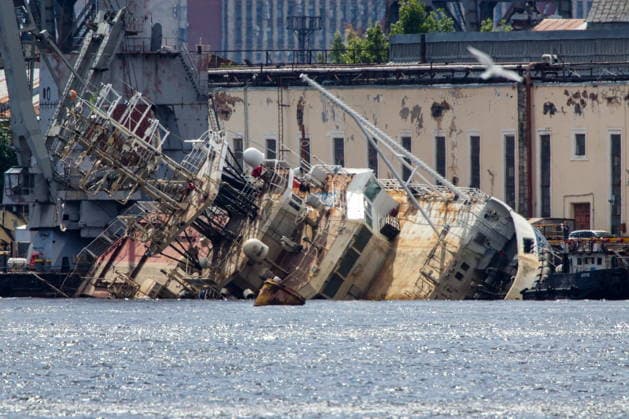 RUSSIA, ST PETERSBURG - JUNE 25, 2026: Salvage operations are underway for the Kapitan Ushakov tugboat at the Baltic Shipyard. The vessel partially sank on 8 August 2025, after listing to its starboard during construction work; no injuries reported. The damage was estimated by specialists from the North-Western Interregional Directorate of the Federal Service for Supervision of Natural Resources (Rosprirodnadzor) at 651 million rubles. Peter Kovalev TASS  94260504