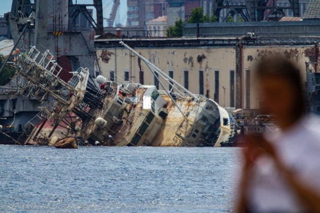 RUSSIA, ST PETERSBURG - JUNE 25, 2026: Salvage operations are underway for the Kapitan Ushakov tugboat at the Baltic Shipyard. The vessel partially sank on 8 August 2025, after listing to its starboard during construction work; no injuries reported. The damage was estimated by specialists from the North-Western Interregional Directorate of the Federal Service for Supervision of Natural Resources (Rosprirodnadzor) at 651 million rubles. Peter Kovalev TASS  94260506