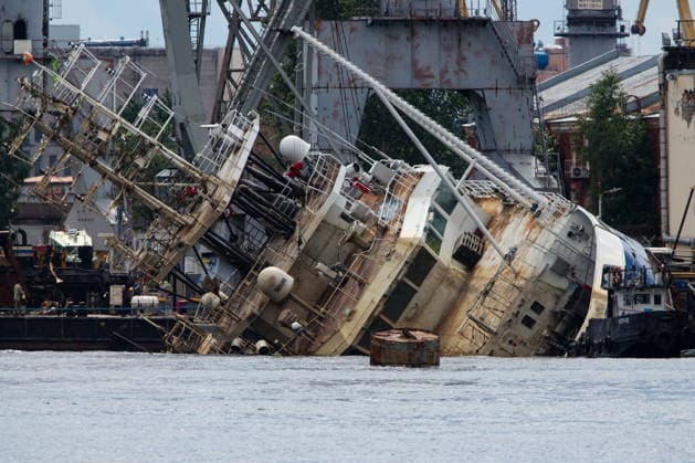 RUSSIA, ST PETERSBURG - JUNE 25, 2026: Salvage operations are underway for the Kapitan Ushakov tugboat at the Baltic Shipyard. The vessel partially sank on 8 August 2025, after listing to its starboard during construction work; no injuries reported. The damage was estimated by specialists from the North-Western Interregional Directorate of the Federal Service for Supervision of Natural Resources (Rosprirodnadzor) at 651 million rubles. Peter Kovalev TASS  94260512