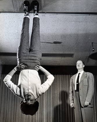 RECORD DATE NOT STATED Photograph depicting Nancy Wendler demonstrating zero gravity shoes Photograph depicting Nancy Wendler demonstrating zero gravity shoes for their developer, John F. Heard. The soles of the shoes are covered with minute nylon hooks that engage with a carpeted surface to create the fastening effect. The holding power of the material is great enough to suspend the weight of an average size person even with the earth s gravity pulling. In space, relatively small amounts of the hook material would be required to keep an astronaut walking properly. Dated 20th century Editorial use only. All other uses to be cleared with the copyright owner (World History Archive), in advance., WHA_106_0244.jpg, Nancy Wendler; zero gravity s Copyright: xx