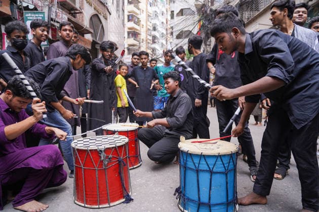 June 26, 2026, Dhaka, Dhaka, Bangladesh: Dhaka, June 26, 2026: Marking the 10th day of Muharram, the holy day of Ashura, members of the Shia Muslim community observed the occasion with Tazia processions, matam (ritual mourning), and other religious ceremonies in remembrance of the martyrdom of Imam Hussain, the grandson of Prophet Muhammad, at the Battle of Karbala. The mourning procession began at the historic Hussaini Dalan in Old Dhaka and concluded at Zigatola. As part of the observance, some devotees donated chickens and pigeons as acts of charity and devotion. People from different communities gathered along both sides of the roads to watch the Ashura procession, reflecting the day s profound religious and cultural significance. Dhak - ZUMAk185 20260626_zip_k185_007 Copyright: xRubelxKarmakerx
