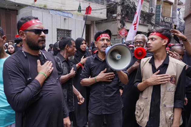 June 26, 2026, Dhaka, Dhaka, Bangladesh: Dhaka, June 26, 2026: Marking the 10th day of Muharram, the holy day of Ashura, members of the Shia Muslim community observed the occasion with Tazia processions, matam (ritual mourning), and other religious ceremonies in remembrance of the martyrdom of Imam Hussain, the grandson of Prophet Muhammad, at the Battle of Karbala. The mourning procession began at the historic Hussaini Dalan in Old Dhaka and concluded at Zigatola. As part of the observance, some devotees donated chickens and pigeons as acts of charity and devotion. People from different communities gathered along both sides of the roads to watch the Ashura procession, reflecting the day s profound religious and cultural significance. Dhak - ZUMAk185 20260626_zip_k185_013 Copyright: xRubelxKarmakerx