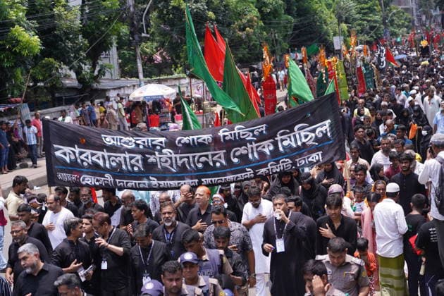 June 26, 2026, Dhaka, Dhaka, Bangladesh: Dhaka, June 26, 2026: Marking the 10th day of Muharram, the holy day of Ashura, members of the Shia Muslim community observed the occasion with Tazia processions, matam (ritual mourning), and other religious ceremonies in remembrance of the martyrdom of Imam Hussain, the grandson of Prophet Muhammad, at the Battle of Karbala. The mourning procession began at the historic Hussaini Dalan in Old Dhaka and concluded at Zigatola. As part of the observance, some devotees donated chickens and pigeons as acts of charity and devotion. People from different communities gathered along both sides of the roads to watch the Ashura procession, reflecting the day s profound religious and cultural significance. Dhak - ZUMAk185 20260626_zip_k185_033 Copyright: xRubelxKarmakerx