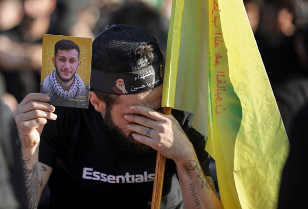 June 26, 2026, Beirut, Beirut, Lebanon: A pro-Iranian Hezbollah supporter mourns as he shows a picture of a relative, who was killed in fighting against Israel, during a ceremony at Beirut southern suburb on the last day of Ashoura, that marks the 7th century martyrdom of Imam Hussein, grandson of the Prophet Muhammad, at the Battle of Karbala in A.D. 680. This year, Ashoura comes after months of war in Iran and Lebanon, homes to two of the worldÃ¢â‚¬â ¢s largest Shiite populations. Iran and the U.S. this week launched talks aimed at finalizing a fragile ceasefire agreement. Hezbollah leader Naim Qassem said that Israel must withdraw completely from Lebanon, accusing it of seeking to occupy the country and warning that it would leave Ã¢â‚¬Å - ZUMAn313 20260626_zip_n313_018 Copyright: xMarwanxNaamanix