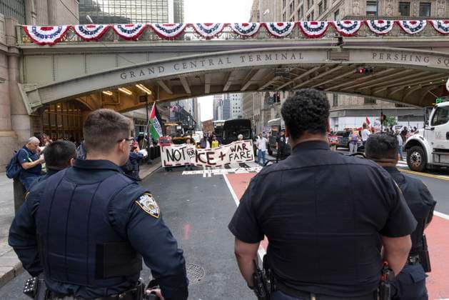 June 26, 2026, New York, New York, USA: Members of ACT UP New York begin Pride weekend with an act of civil disobedience blockading traffic during the morning rush hour on 42nd Street outside Grand Central Station stating solidarity with striking Delaney Hall immigrant detainees and denouncing Trump administration cuts to AIDS funding and healthcare. After traffic is at a standstill for approximately 40 minutes, NYPD arrests demonstrators. The protest banner is Ã¢â‚¬ËœMoney for AIDS and Healthcare Not for ICE and Warfare. Demonstrators defend New YorkÃ¢â‚¬â ¢s sanctuary city status as an ICE surge is promised and protest funding cuts to AIDS Drug Assistance Programs (ADAP,) The U.S. PresidentÃ¢â‚¬â ¢s Emergency Plan for AIDS Relief (PEPFAR - ZUMAr174 20260626_znp_r174_010 Copyright: xGinaxMxRandazzox