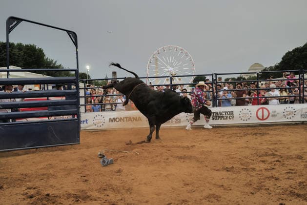 June 26, 2026, Washington, District Of Columbia, USA: A rodeo worker runs from a bucking bull at a rodeo during the Great American State Fair on the National Mall in Washington, D.C. on June 26, 2026. Rodeo 250, produced by Cervi Rodeo Company, is one of numerous events during the 16-day fair, celebrating the 250th anniversary of the United States of America. Washington USA - ZUMAd227 20260626_znp_d227_052 Copyright: xBryanxDozierx