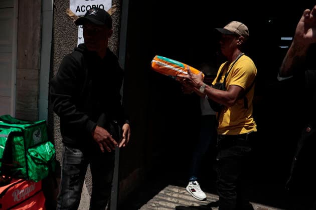 June 26, 2026, Mexico City, Cdmx, Mexico: In response to earthquakes that have caused material losses and casualties in Venezuela, the country s embassy in Mexico City opened its doors as a collection center. It is accepting humanitarian aid brought by Mexicans, foreign nationals, and Venezuelans living in Mexico to provide support during this time. On the first day of accepting itemsâ€including medicines, non-perishable food, water, and hygiene productsâ€dozens of Venezuelans working as app-based delivery drivers arrived at the embassy. Carrying flags and singing their national anthem, they brought supplies needed by their relatives and fellow citizens. Many stated that while their people endure this crisis caused by natural di - ZUMAp204 20260626_zip_p204_058 Copyright: xJosuexPerezx
