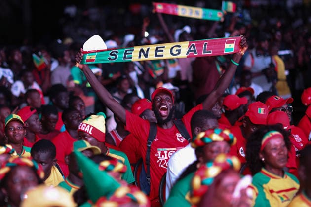 Senegal fans celebrate national team s World Cup victory in Dakar DAKAR, SENEGAL - JUNE 27: Senegalese fans celebrate their national team s 5-0 victory over Iraq in the FIFA World Cup at Place de la Nation in Dakar, Senegal, on June 27, 2026. Hundreds of supporters watch the match on giant screens set up in the square and cheer as Senegal scores each goal. Cem Ozdel Anadolu Dakar Senegal. Editorial use only. Please get in touch for any other usage.  Copyright: x2026xAnadoluxCemxOzdelx