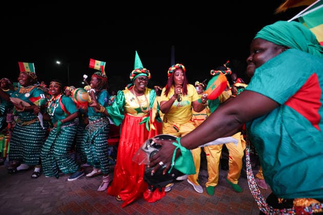 Senegal fans celebrate national team s World Cup victory in Dakar DAKAR, SENEGAL - JUNE 27: Senegalese fans celebrate their national team s 5-0 victory over Iraq in the FIFA World Cup at Place de la Nation in Dakar, Senegal, on June 27, 2026. Hundreds of supporters watch the match on giant screens set up in the square and cheer as Senegal scores each goal. Cem Ozdel Anadolu Dakar Senegal. Editorial use only. Please get in touch for any other usage.  Copyright: x2026xAnadoluxCemxOzdelx