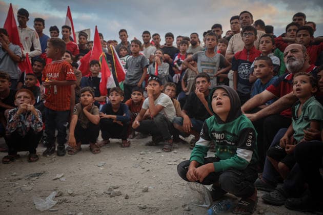 Palestinians watch the Iran-Egypt match on giant screens set up amid the rubble GAZA CITY, GAZA, PALESTINE - JUNE 27: Palestinians holding flags gather to watch the 2026 FIFA World Cup First Stage Group G match between Egypt and Iran on a giant screen set up among the rubble of destroyed buildings despite Israel s ongoing attacks in Gaza City, Gaza, Palestine, on June 27, 2026. Abdalhkem Abu Riash Anadolu Gaza City Gaza. Editorial use only. Please get in touch for any other usage.  Copyright: x2026xAnadoluxAbdalhkemxAbuxRiashx