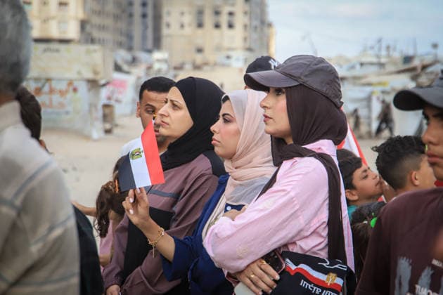 Palestinians watch the Iran-Egypt match on giant screens set up amid the rubble GAZA CITY, GAZA, PALESTINE - JUNE 27: Palestinians holding flags gather to watch the 2026 FIFA World Cup First Stage Group G match between Egypt and Iran on a giant screen set up among the rubble of destroyed buildings despite Israel s ongoing attacks in Gaza City, Gaza, Palestine, on June 27, 2026. Abdalhkem Abu Riash Anadolu Gaza City Gaza. Editorial use only. Please get in touch for any other usage.  Copyright: x2026xAnadoluxAbdalhkemxAbuxRiashx