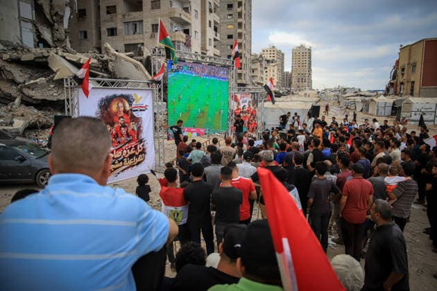 Palestinians watch the Iran-Egypt match on giant screens set up amid the rubble GAZA CITY, GAZA, PALESTINE - JUNE 27: Palestinians holding flags gather to watch the 2026 FIFA World Cup First Stage Group G match between Egypt and Iran on a giant screen set up among the rubble of destroyed buildings despite Israel s ongoing attacks in Gaza City, Gaza, Palestine, on June 27, 2026. Abdalhkem Abu Riash Anadolu Gaza City Gaza. Editorial use only. Please get in touch for any other usage.  Copyright: x2026xAnadoluxAbdalhkemxAbuxRiashx