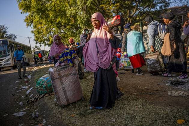 Undocumented Malawian migrants are being evacuated from South Africa KWAZULU-NATAL, SOUTH AFRICA - JUNE 26: Women are seen with their loads as thousands of Malawian migrants were put on buses to return to their home country following a rise in xenophobic attacks and anti-immigrant protests in the city of Pietermaritzburg in KwaZulu-Natal province, South Africa, on June 26, 2026. Ihsaan Haffejee Anadolu KwaZulu-Natal South Africa. Editorial use only. Please get in touch for any other usage.  Copyright: x2026xAnadoluxIhsaanxHaffejeex