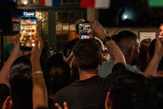 June 26, 2026, London, United Kingdom: View from a back of a packed out pub of crowds holding phones in the air to capture Danny O Donoghue performance with his band The Script. Irish band The Script fronted by Danny O Donoghue played a durpeise pop up gig in a pub The Dog formally known as The Dog and Truck in Whitechapel London after playing London Stadium supporting Take That on their tour. London United Kingdom  - ZUMAs197 20260626_aaa_s197_235 Copyright: xBonniexBritainx