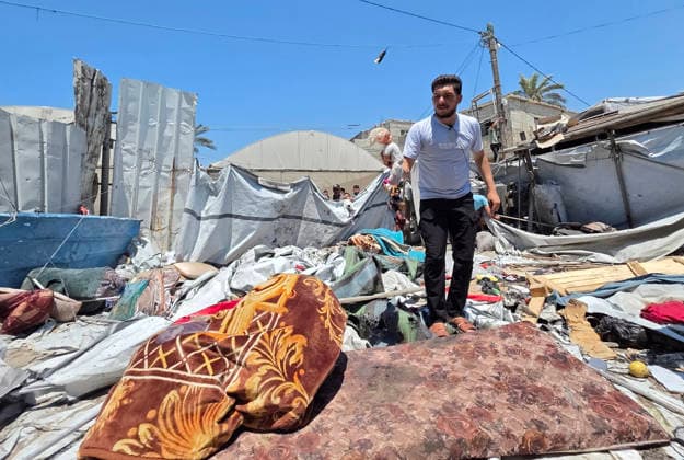 Displaced Palestinians inspect damaged tents after strike in al-Mawasi Displaced Palestinians inspect damage to their tents after an Israeli strike targeted a tent in the al-Mawasi area of Khan Younis, southern Gaza Strip, on June 27, 2026. The strike killed a young man and a child, wounded others, and caused extensive damage to displaced families tents and belongings. Photo by Tariq Mohammad APA Images Khan Yunis Gaza Strip Palestinian Territory 270626_Khan_Yunis_TM_02(17) Copyright: xapaimagesxTariqxMohammad xapaimagesx