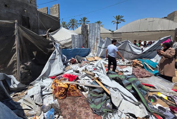 Displaced Palestinians inspect damaged tents after strike in al-Mawasi Displaced Palestinians inspect damage to their tents after an Israeli strike targeted a tent in the al-Mawasi area of Khan Younis, southern Gaza Strip, on June 27, 2026. The strike killed a young man and a child, wounded others, and caused extensive damage to displaced families tents and belongings. Photo by Tariq Mohammad APA Images Khan Yunis Gaza Strip Palestinian Territory 270626_Khan_Yunis_TM_02(10) Copyright: xapaimagesxTariqxMohammad xapaimagesx