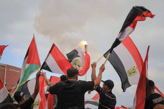 Displaced Gazans Watch Egypt-Iran World Cup Match Amid War Devastation GAZA, PALESTINE JUNE 27: Palestinians watch the FIFA World Cup 2026 match between Egypt and Iran among tents and the widespread destruction caused by the ongoing war in the Gaza Strip on the morning of June 27, 2026. Despite displacement and harsh humanitarian conditions, residents gather to follow the tournament as football offers a brief escape from daily hardships. Gaza Palestine, State of Copyright: x xMohammedxMxSkaikx xJNAxPressx
