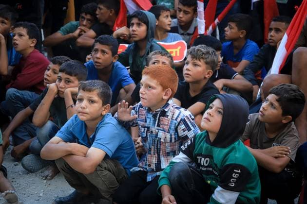 Displaced Gazans Watch Egypt-Iran World Cup Match Amid War Devastation GAZA, PALESTINE JUNE 27: Palestinians watch the FIFA World Cup 2026 match between Egypt and Iran among tents and the widespread destruction caused by the ongoing war in the Gaza Strip on the morning of June 27, 2026. Despite displacement and harsh humanitarian conditions, residents gather to follow the tournament as football offers a brief escape from daily hardships. Gaza Palestine, State of Copyright: x xMohammedxMxSkaikx xJNAxPressx