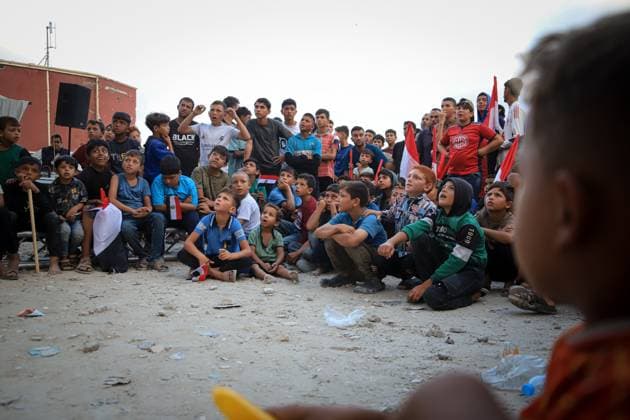 Displaced Gazans Watch Egypt-Iran World Cup Match Amid War Devastation GAZA, PALESTINE JUNE 27: Palestinians watch the FIFA World Cup 2026 match between Egypt and Iran among tents and the widespread destruction caused by the ongoing war in the Gaza Strip on the morning of June 27, 2026. Despite displacement and harsh humanitarian conditions, residents gather to follow the tournament as football offers a brief escape from daily hardships. Gaza Palestine, State of Copyright: x xMohammedxMxSkaikx xJNAxPressx