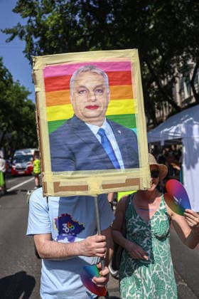 June 27, 2026, Budapest, Hungary, European Union: A person holds a sign with Vikor OrbanÃ¢â‚¬â ¢s face painted with makeup and in front of a pride flag during Budapest Pride, the first Pride march held since HungaryÃ¢â‚¬â ¢s April 2026 parliamentary election. The annual event brought together LGBTQ+ people, allies and supporters calling for equality, visibility and acceptance. Budapest European Union  - ZUMAo116 20260627_znp_o116_064 Copyright: xBiancaxOterox