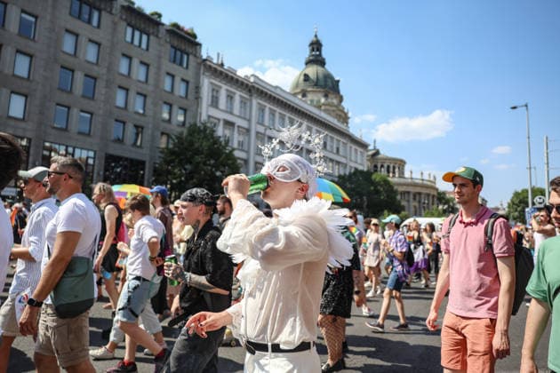 June 27, 2026, Budapest, Hungary, European Union: A young person wearing all white with angel details and a carnival mask, drinks a beer with the Basilica dome seen int the background, during Budapest Pride, the first Pride march held since HungaryÃ¢â‚¬â ¢s April 2026 parliamentary election. The annual event brought together LGBTQ+ people, allies and supporters calling for equality, visibility and acceptance. Budapest European Union  - ZUMAo116 20260627_znp_o116_073 Copyright: xBiancaxOterox