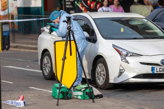 June 27, 2026, London, London, UK: London, UK. A police forensic officer gathers evidence as emergency services are at the scene in Ealing Broadway, west London, after a car struck pedestrians outside Marks & Spencer. London UK  - ZUMAl94_ 20260627_zaf_l94_028 Copyright: xMarcinxNowakx