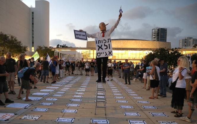 Protest against government in Tel Aviv TEL AVIV, ISRAEL - JUNE 27: People stage a protest against Prime Minister Benjamin Netanyahu and the current government as they gather in Habima Square in Tel Aviv, Israel on June 27, 2026. Protestors, calling on Israel to end its attacks on Gaza and Lebanon, carried placards criticizing the government’s war policies and the compulsory military service imposed on Ultra-Orthodox (Haredi) Jews. Gideon Markowicz Anadolu Tel Aviv Israel. Editorial use only. Please get in touch for any other usage.  Copyright: x2026xAnadoluxGideonxMarkowiczx
