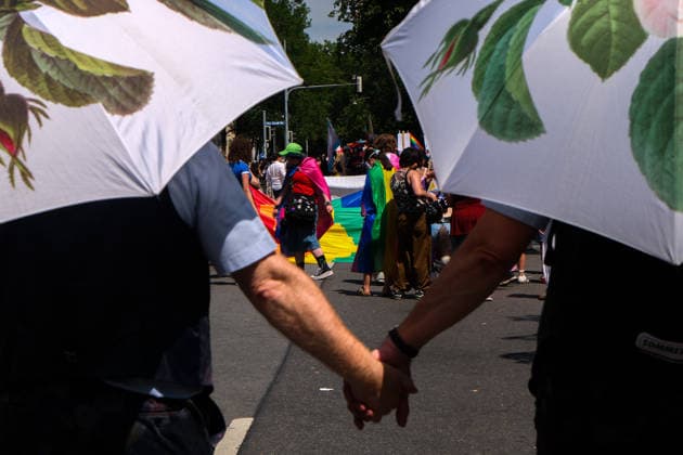 June 27, 2026, Munich, Bayern, Germany: People march through Munich s streets under the banner Our diversity. Our strength to advocate for LGBTQIA+ rights, despite high temperatures. Munich Germany - ZUMAm309 20260627_zip_m309_025 Copyright: xJuliusxMortsix