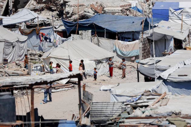 Jabalia Gaza Daily Life Palestinian children walk among the rubble of destroyed buildings in Jabalia, northern Gaza Strip on June 27, 2026. Residents remain among the ruins of damaged and destroyed buildings in Jabalia, where access to basic services such as water, electricity, and shelter remains severely limited. Gaza Gaza Strip Palestinian Territories Copyright: xAhmedxAlxArinix