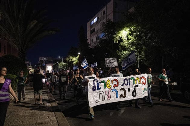Anti-government protest held in West Jerusalem WEST JERUSALEM - JUNE 27: Dozens of Israelis gather to protest against Prime Minister Benjamin Netanyahu and the current government, calling for their resignation and early elections, in West Jerusalem on June 27, 2026. Demonstrators carry placards criticizing Israeli military operations and settlement policies, chant slogans against Netanyahu, and express opposition to what they describe as genocide in Gaza. Mostafa Alkharouf Anadolu Jerusalem Israel. Editorial use only. Please get in touch for any other usage.  Copyright: x2026xAnadoluxMostafaxAlkharoufx