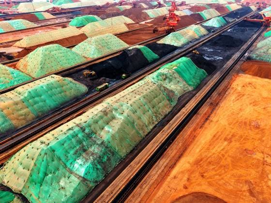 Qingdao Port Ore Terminal Construction machinery is sorting and loading imported iron ore at the Qingdao Port Ore Terminal in Qingdao, Shandong Province, China on June 28, 2026. Qingdao Shandong China  Copyright: xCFOTOx i1782655941597
