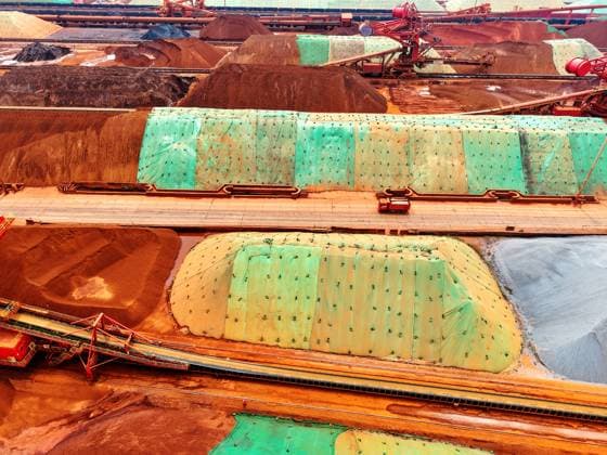 Qingdao Port Ore Terminal Construction machinery is sorting and loading imported iron ore at the Qingdao Port Ore Terminal in Qingdao, Shandong Province, China on June 28, 2026. Qingdao Shandong China  Copyright: xCFOTOx i1782655942187