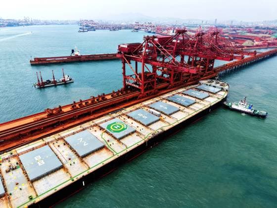 Qingdao Port Ore Terminal A cargo ship carrying imported iron ore docked at the ore terminal berth of Qingdao Port, Qingdao City, Shandong Province, China, on June 28, 2026. Qingdao Shandong China  Copyright: xCFOTOx i1782655945060