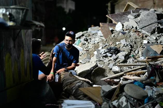 Turkish rescue teams deployed to quake-hit Venezuela LA GUAIRA, VENEZUELA - JUNE 28: Residents wait for their loved ones to be pulled out from rubble of collapsed 14-story building by Turkish search and rescue teams, including specialist personnel from the Disaster and Emergency Management Authority (AFAD) and the Turkish Armed Forces, in the La Paez neighborhood of La Guaira, Venezuela, on June 28, 2026. Following a series of devastating, high-magnitude earthquakes that struck Venezuela, Turkish emergency crews swiftly deployed to the hard-hit coastal city of La Guaira. Cem Tekkesinoglu Anadolu La Guaira Venezuela. Editorial use only. Please get in touch for any other usage.  Copyright: x2026xAnadoluxCemxTekkesinoglux