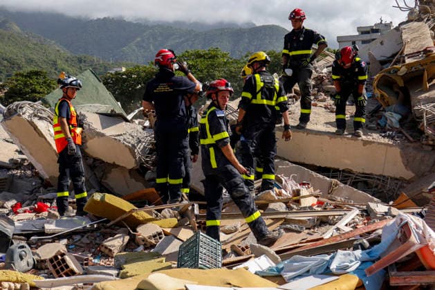 Members of Caracas firefighters search for victims amid debris of a demolished building after a magnitude 7.2 earthquake struck Venezuela and other regions in the Caribbean in La Guaira, Venezuela, on June 27, 2026. According to the U.S. Geological Survey, a powerful 7.5?magnitude aftershock struck after the main quake. Medical and media sources reported that the death toll has risen to around 1,500, with some 3,000 others injured. A web page created to track the missing has listed nearly 50,000 people as unaccounted for. photo by Jonathan Lanza  VAN2026062806 JonathanxLanza