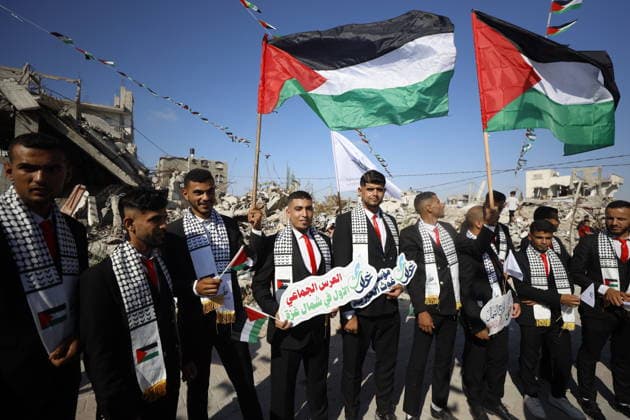 150 Palestinian couples tie the knot in mass wedding at Jabalia Camp GAZA, PALESTINE - JUNE 28: Newlyweds celebrate as 150 Palestinian couples tie the knot in a mass wedding ceremony organized by a charity organization at the Jabalia Refugee Camp in the northern Gaza Strip, Gaza, Palestine on June 28, 2026. The young couples advanced towards the wedding hall accompanied by traditional songs and dances. Ahmed Jihad Ibrahim Al-arini Anadolu Gaza City Gaza. Editorial use only. Please get in touch for any other usage.  Copyright: x2026xAnadoluxAhmedxJihadxIbrahimxAl-arinix