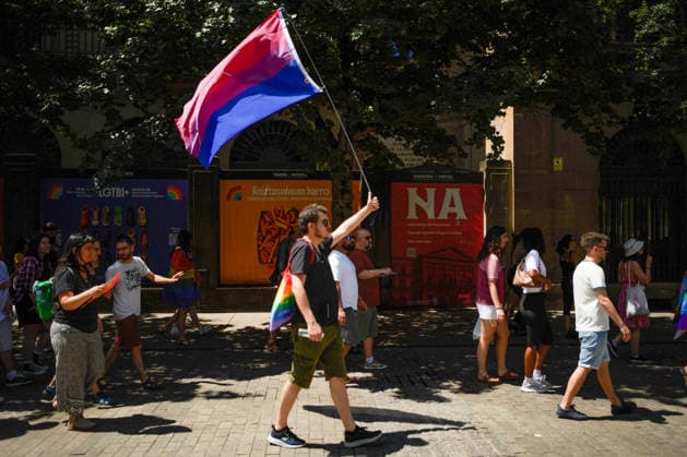June 28, 2026, Pamplona, Spain: A demonstrator holds a bisexual flag during the Gay Pride march. Hundreds of people participated in the demonstration held to mark International LGBTI+ Pride Day. The main focus of the demonstration was the discrimination against the refugee community, and of course, respect from institutions, while some feminist groups are excluding transgender people. Pamplona Spain  - ZUMAs197 20260628_aaa_s197_073 Copyright: xElsaxAxBravox