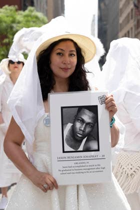 June 28, 2026, New York, New York, USA: The 57th annual NYC Pride March proceeds down Fifth Avenue from Midtown to Greenwich Village. The direct-action group Gays Against Guns is a Grand Marshal in this year s march. One of the Human Beings marches with them representing a person lost to gun violence. They hold a placard that reads JASON BENJAIMIN JOSAPHAT with his picture. Nonviolently challenging gun violence, the organization was founded in response to the loss of 49 lives at Pulse Nightclub on June 12, 2016. The theme of Pride For All of Us honors the legacy of activist Marsha P. Johnson. New York USA - ZUMAr174 20260628_znp_r174_005 Copyright: xGinaxMxRandazzox