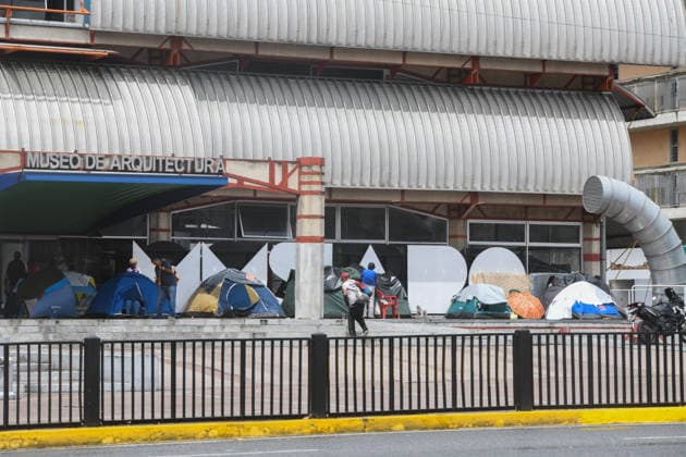 (260629) -- CARACAS, June 29, 2026 -- People affected by earthquakes rest in their tents in front of the Architecture Museum in Caracas, Venezuela, June 28, 2026. Venezuelan National Assembly President Jorge Rodriguez said Sunday that the death toll from two powerful earthquakes that struck Venezuela Wednesday has risen to 1,450. (Photo by Xinhua) (SpotNews) VENEZUELA-CARACAS-EARTHQUAKE-AFTERMATH MarcosxSalgado 