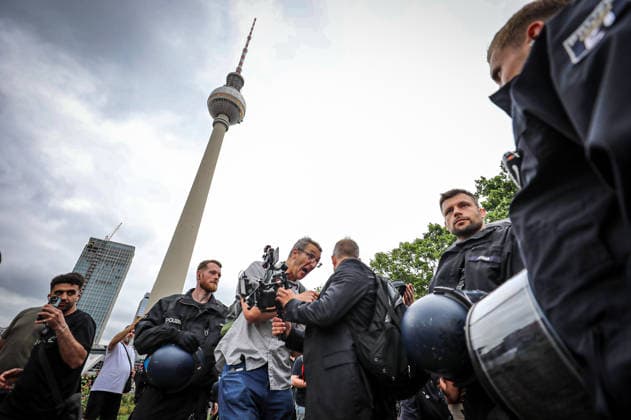 June 29, 2026, Berlin, Berlin, Germany: BERLIN, GERMANY Ã¢â‚¬ JUNE 29, 2026: Counter-demonstrators gather at Alexanderplatz during a protest against the far-right Alternative for Germany (AfD) party, while AfD supporters hold a nearby rally under a heavy police presence. Demonstrators carried banners calling for a ban on the AfD, anti-fascist slogans, LGBTQ+ pride flags and anti-racism messages as officers separated the opposing groups in central Berlin. ZUMA Press Wire Berlin Germany - ZUMAa268 20260629_zip_a268_011 Copyright: xAbdelrahmanxAlkahloutx