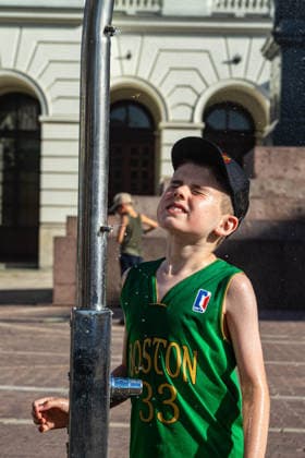 June 27, 2026, Warsaw, Mazovia, Poland: A young boy enjoys the relief of a cooling misting station. On the afternoon of the 28th of June, Varsovians cool and hydrate themselves around the city during a record-breaking heatwave. Due to the extreme heat, the authorities provided misting sprays and water tanks around the city. During the weekend, Warsaw experienced temperatures approaching 38Â°C as the unprecedented European heatwave swept across Poland, roughly 15Â°C above the late-June average. Tropical nights, nationwide heat alerts, and temperatures up to 40.5Â°C elsewhere in the country made this one of the most extreme heat events in modern Polish history. Warsaw Poland - ZUMAs197 20260627_aaa_s197_334 Copyright: xNeilxMiltonx