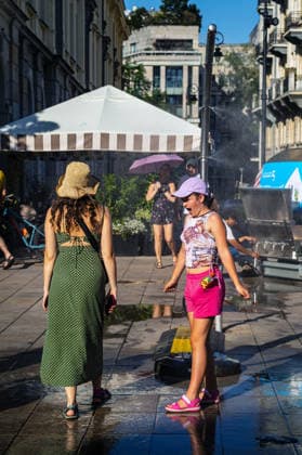 June 27, 2026, Warsaw, Mazovia, Poland: A lady enjoys the relief of a cooling misting station. On the afternoon of the 28th of June, Varsovians cool and hydrate themselves around the city during a record-breaking heatwave. Due to the extreme heat, the authorities provided misting sprays and water tanks around the city. During the weekend, Warsaw experienced temperatures approaching 38Â°C as the unprecedented European heatwave swept across Poland, roughly 15Â°C above the late-June average. Tropical nights, nationwide heat alerts, and temperatures up to 40.5Â°C elsewhere in the country made this one of the most extreme heat events in modern Polish history. Warsaw Poland - ZUMAs197 20260627_aaa_s197_349 Copyright: xNeilxMiltonx