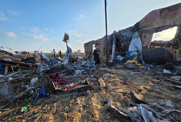 Displaced Families Inspect Damage After Israeli Airstrike in al-Mawasi Palestinian displaced families inspect damage to their tents and belongings following an Israeli airstrike that targeted a camp for displaced people in the al-Mawasi area of Khan Younis, southern Gaza Strip, on June 30, 2026. The Israeli army carried out the strike despite a ceasefire, causing extensive damage across the area. Photo by Tariq Mohammad APA Images Khan Yunis Gaza Strip Palestinian Territory 300626_Khan_Yunis_TM_00(30) Copyright: xapaimagesxTariqxMohammad xapaimagesx