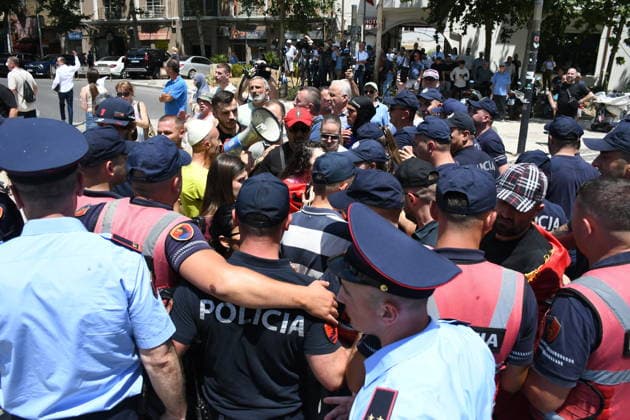 Protest held in front of Parliament building against tourism projects in Tirana TIRANA, ALBANIA - JUNE 30: Demonstrators gather in front of the Parliament building to protest against a planned tourism project in the Zvernec area of Vlora, in Tirana, Albania on June 30, 2026. Scuffles broke out between police and protestors during the demonstration, which has been ongoing for a month. Reinforcements arrived at the protest area to form a security cordon. Olsi Shehu Anadolu Tirana Albania. Editorial use only. Please get in touch for any other usage.  Copyright: x2026xAnadoluxOlsixShehux