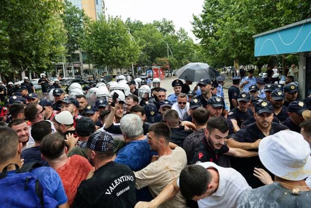 Police and Protesters Clash Outside Albanian Parliament TIRANA, ALBANIA JUNE 30, 2026: Demonstrators gathered outside the Albanian Parliament in Tirana during a new phase of the ongoing protests against a proposed luxury tourism development project linked to Jared Kushner. Protesters confronted lawmakers as they arrived for and departed from the parliamentary session, chanting slogans accusing members of parliament of failing to represent citizens and throwing eggs toward official vehicles. Police intervened after tensions escalated, using pepper spray and detaining several demonstrators during brief clashes outside the parliament building. The protest movement later continued with its daily evening demonstration outside the Prime Minis Copyright: x xVlasovxSulajx xJNAxPressx
