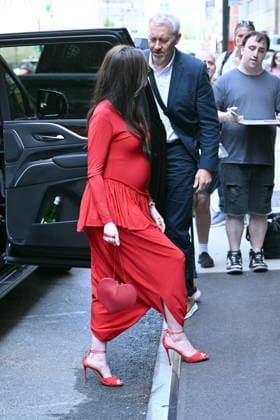 Anne Hathaway shows off her growing baby bump in a skin tight red jumpsuit designed by Ashlyn while out in New York City. The 43-year-old actress shocked fans by announcing her pregnancy in an Instagram video earlier this month Featuring: Anne Hathaway Where: New York City, New York, United States When: 30 Jun 2026 Credit: Elder Ordonez INSTARimages EDITORIAL USE ONLY. NOT FOR USE BY NEWSPAPERS BASED IN THE UK. Copyright: xx instar55819829