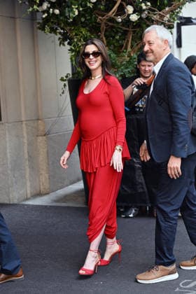 Anne Hathaway shows off her growing baby bump in a skin tight red jumpsuit designed by Ashlyn while out in New York City. The 43-year-old actress shocked fans by announcing her pregnancy in an Instagram video earlier this month Featuring: Anne Hathaway Where: New York City, New York, United States When: 30 Jun 2026 Credit: Elder Ordonez INSTARimages EDITORIAL USE ONLY. NOT FOR USE BY NEWSPAPERS BASED IN THE UK. Copyright: xx instar55819841
