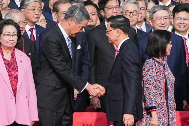 HONG KONG-DAILY HKSAR-ANNIVERSARY Chief Executive John Lee Ka-chiu shakes hands with Leung Chun-ying, Vice-Chairman of the National Committee of the Chinese People s Political Consultative Conference, during the flag-raising ceremony at Golden Bauhinia Square on July 1, 2026 in Hong Kong. (Photo by Kevin Li TMHK via Nexpher Images) Hong Kong