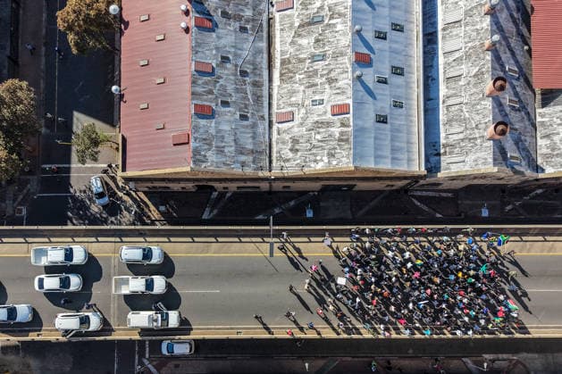 (260701) -- BEIJING, July 1, 2026 -- An aerial drone photo taken on June 30, 2026 shows protesters marching during a massive demonstration against illegal immigration in Johannesburg, South Africa. South African authorities deployed thousands of police officers on Tuesday as demonstrations against illegal immigration were held across the country under heightened security. (Photo by Xinhua) XINHUA PHOTOS OF THE DAY ShiraazxMohamed 
