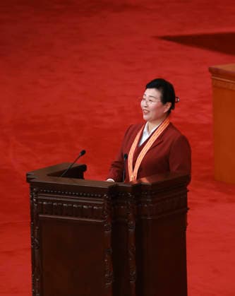 (260701) -- BEIJING, July 1, 2026 -- Wu Yaqin, recipient of the July 1 Medal, speaks at a gathering in celebration of the 105th founding anniversary of the Communist Party of China (CPC) at the Great Hall of the People in Beijing, capital of China, July 1, 2026. ) FOCUS China holds gathering marking 105th founding anniversary of CPC DingxLin 